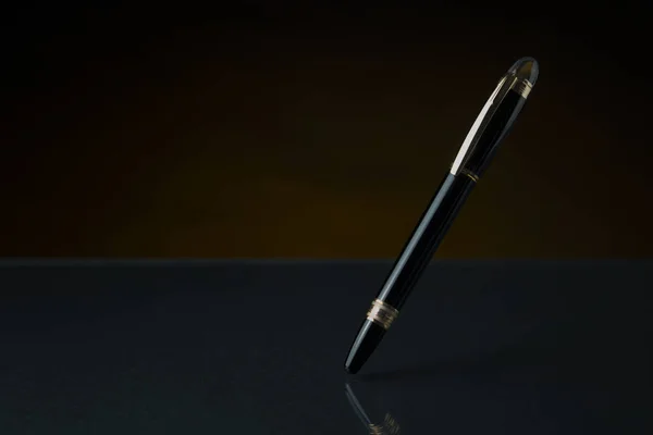fountain pen in black background