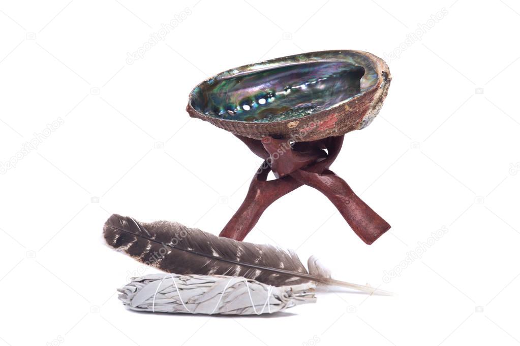 Sage smudge stick, rainbow abalone shell and turkey feather