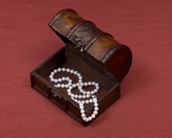 Wooden vintage jewelry box with freshwater white pearls