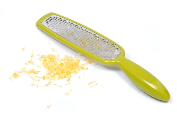 Raspador de aço inoxidável e casca de limão, raspas — Fotografia de Stock