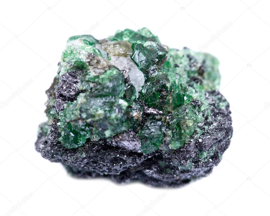 Partially crystallized rough Tsavorite from Tanzania isolated on white background