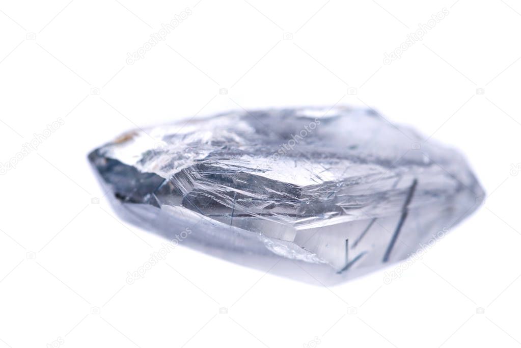 Blue quartz point with tourmaline inclusions from Brazil isolated on white background