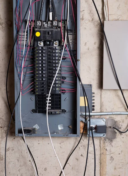 Electrical service panel and branch circuit wiring in the basement of house under remodeling