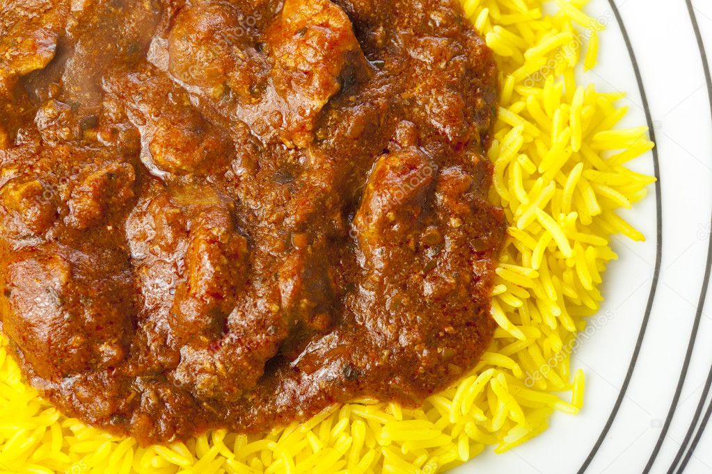 Lamb jalfrezi curry and pilau rice on a plate Stock Photo by ©al8er