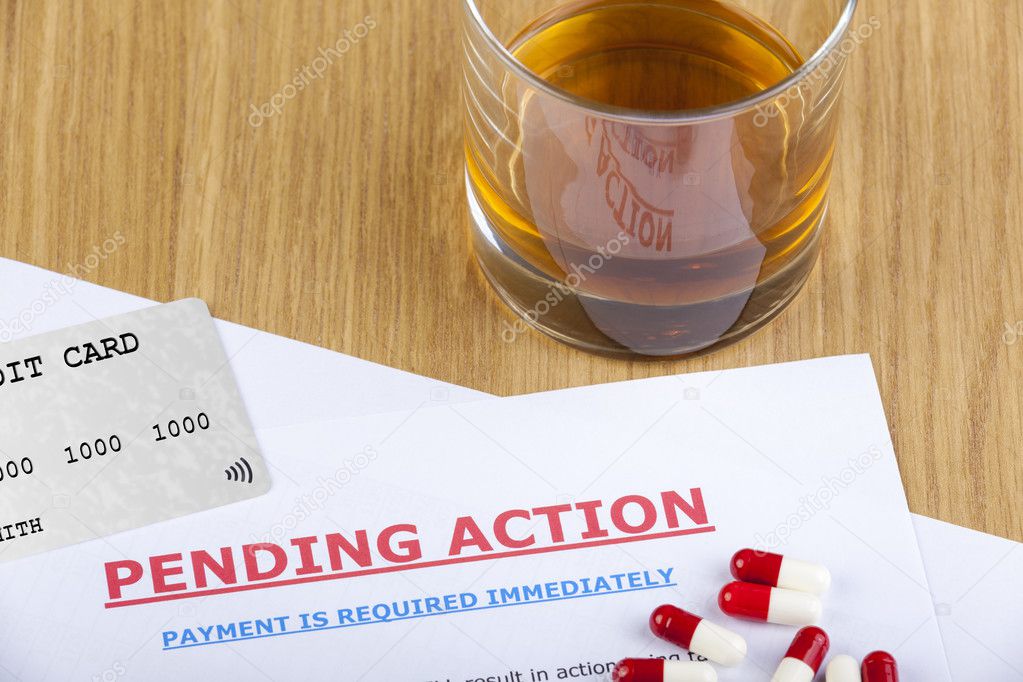 Pending action letter with credit card and pills