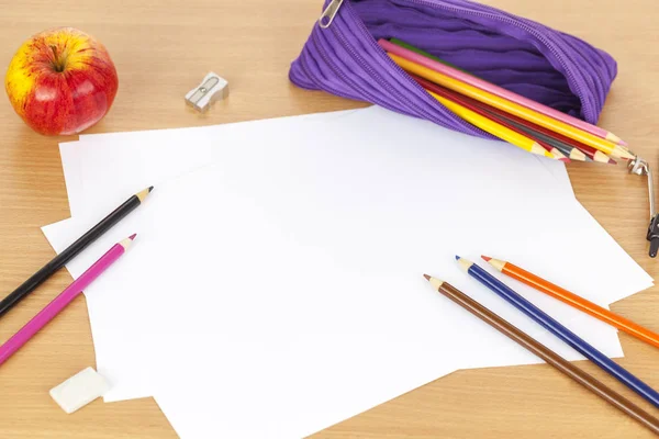 Pencil case and colouring pencils on blank sheets of paper — Stock Photo, Image