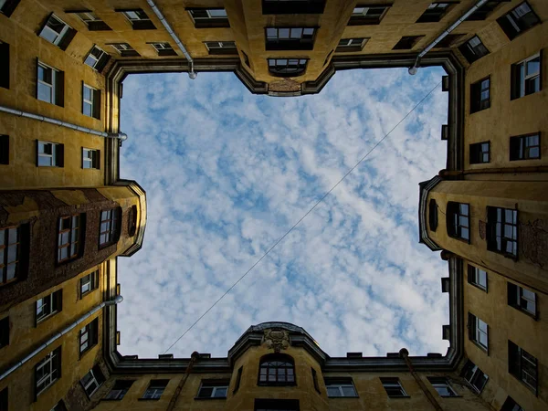 Window to the world in the courtyard-well of old St. Petersburg.