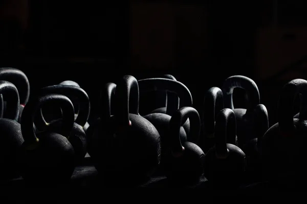 Silhouette Dumbbell for weight training in gym. Black kettlebells.  24kg. Weightlifting. — Stock Photo, Image