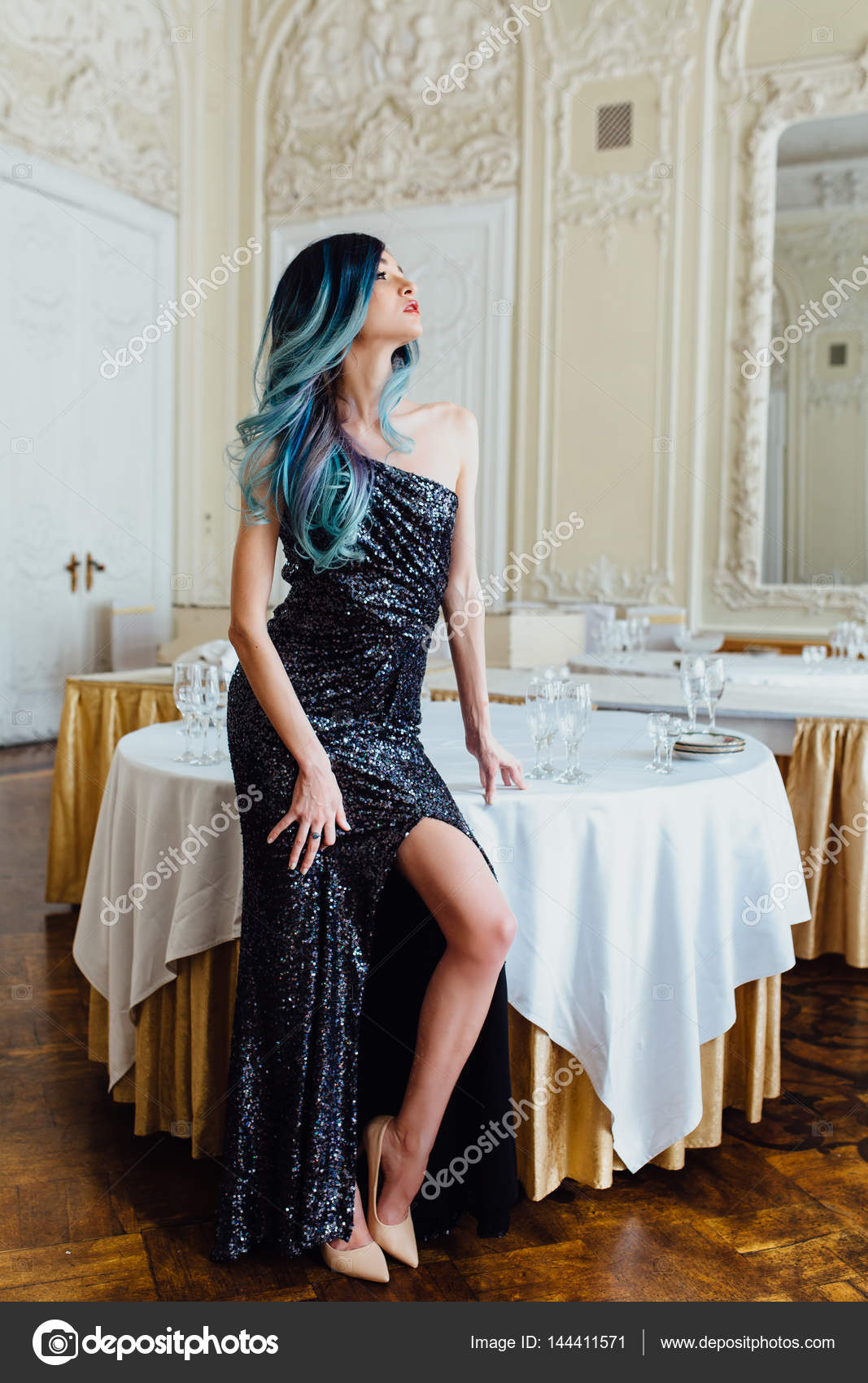 Fashion portrait of gorgeous girl with blue dyed hair long. The beautiful  evening cocktail dress. Stock Photo by ©photominus 144411571