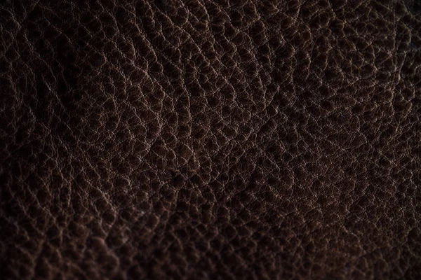 Fragmento macro de una bolsa o bolso de cuero. Hecho a mano, textura de fondo . —  Fotos de Stock