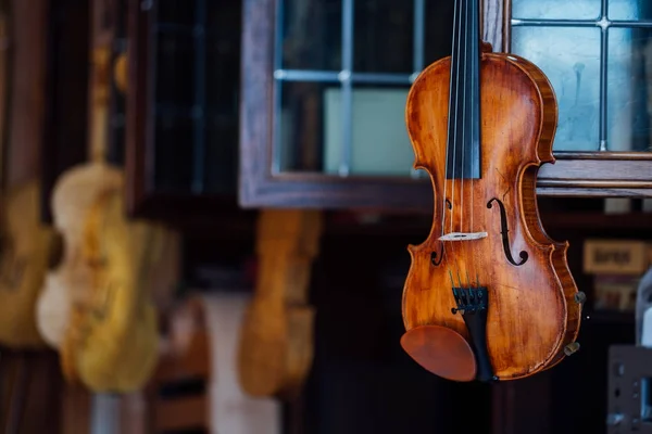 Closeup view of beautiful brown wooden string musical instrument of violin. — Stock Photo, Image