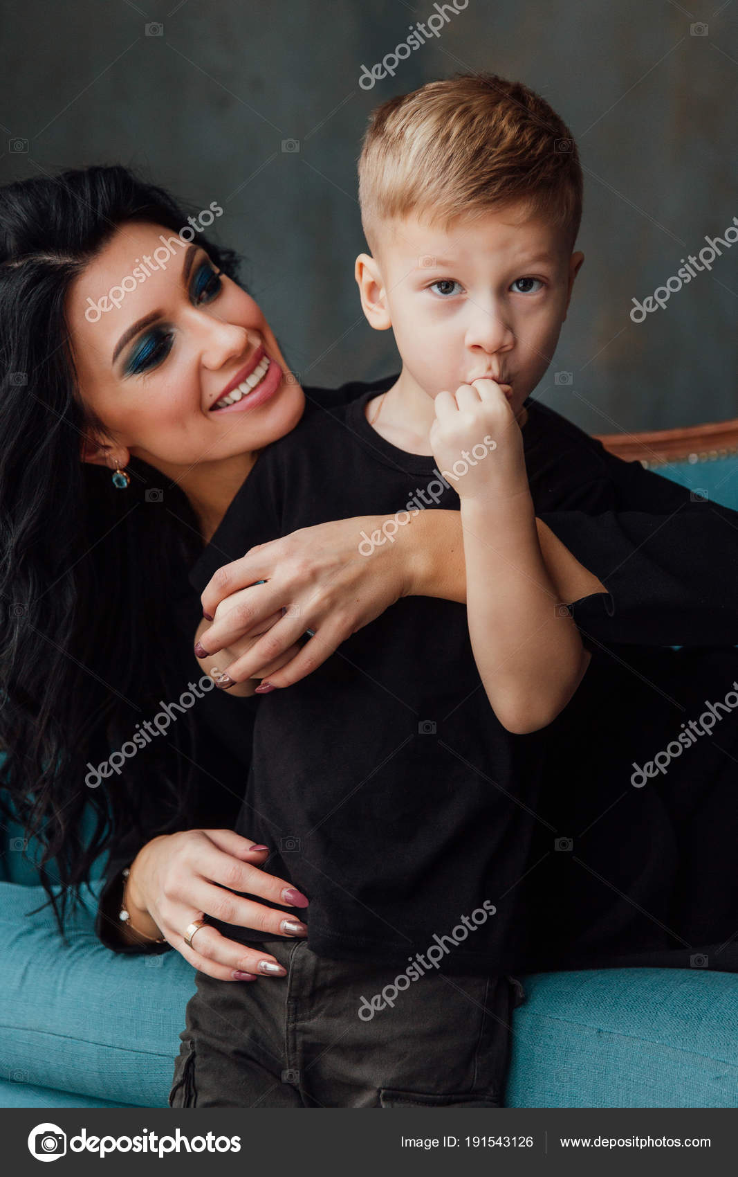 Beautiful Brunette Mom Hugging Her Son Lying On The Sofa Family Mother And Her Cute Boy Black Clothes Stock Image Beautiful Brunette Mom Hugging Her Son Lying On The Sofa Family Mother And Her Cute Boy Black Clothes Stock Image
