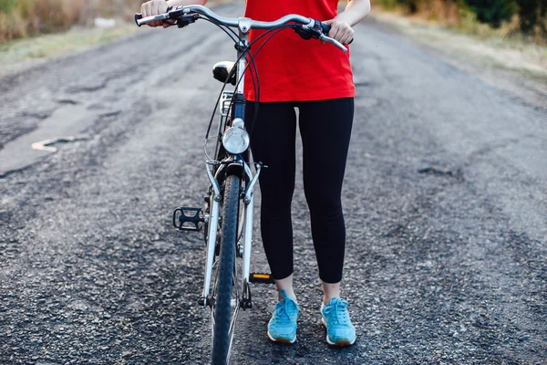 Detail of a bicycle. Female riders on mountain bikes through the — Stock Photo, Image