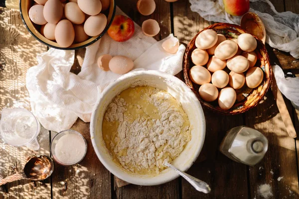 Ingredients for baking cake stuffed with fresh  pie. Female prep