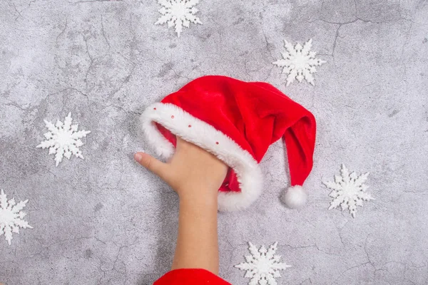 Santa Hat Child Hand Gray Background New Year Christmas Concept — Stock Photo, Image