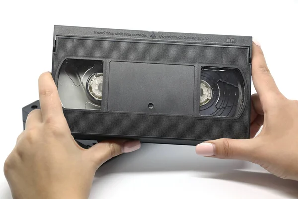 白い背景に隔離された古いVhsの黒いビデオカセット — ストック写真