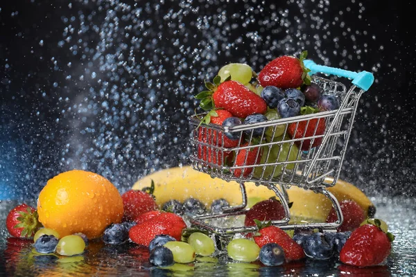 Tropical Fruits Close Blue Shopping Cart Table Strawberry Grape Blueberry — Stock Photo, Image