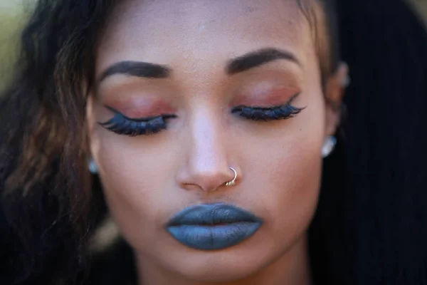Brunette female wearing blue lipstick — Stock Photo, Image