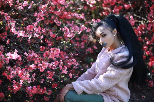 Stylish female posing near sakura tree — Stock Photo, Image