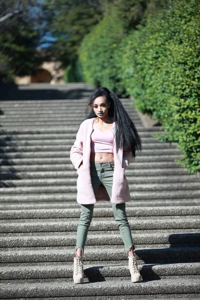 Stylish woman on stairs