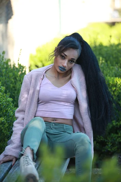 Female posing on bench — Stock Photo, Image