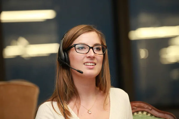 Girl using headset in call center