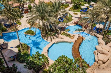 Dubai. In the summer of 2016. The green oasis on the The Ritz Carlton Dubai hotel. clipart