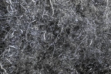 Metal işleme fabrikasında metal talaşı. Metal arka plan filtre renk ile.