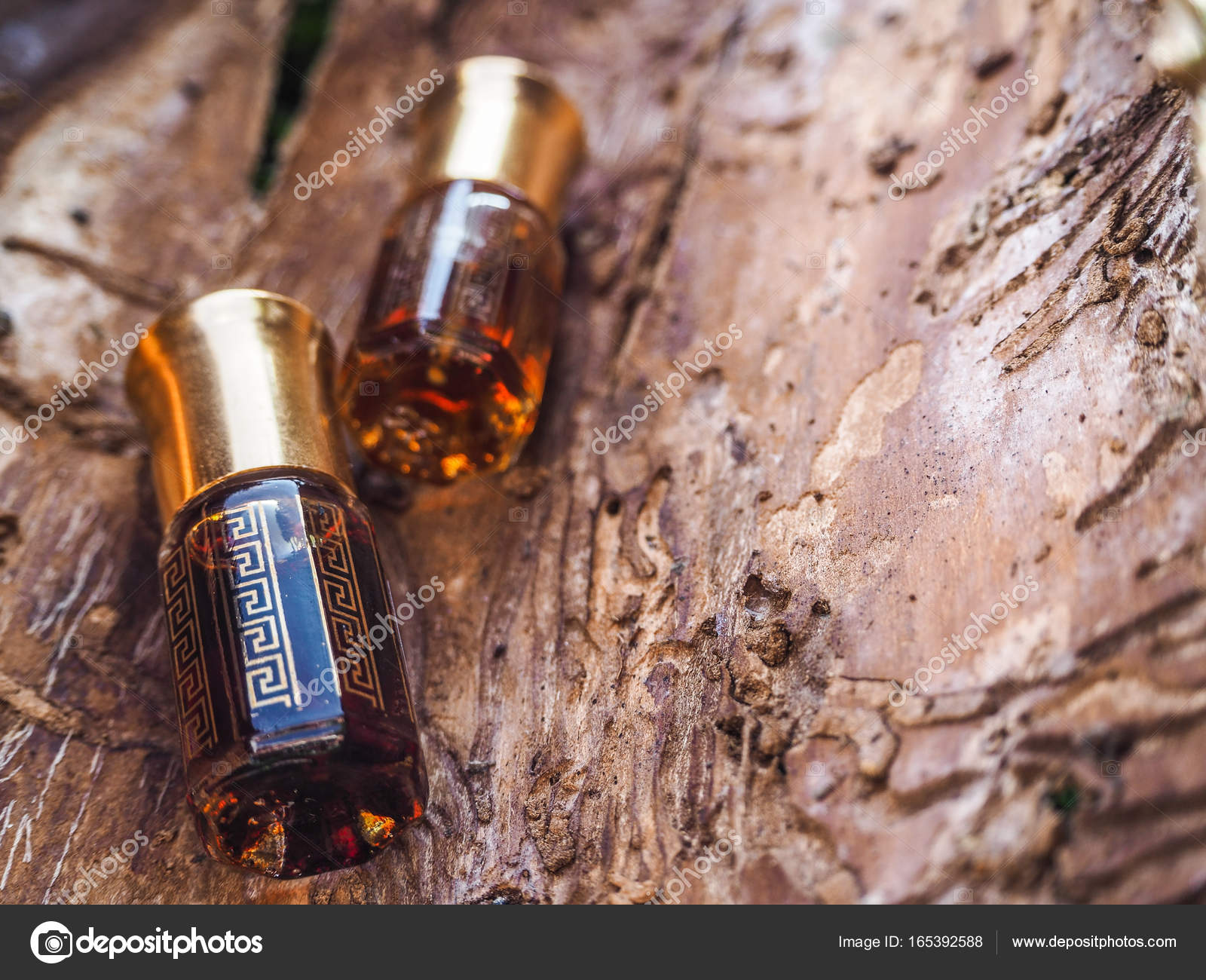 Arabian oud attar perfume or agarwood oil fragrances in mini bottle ...