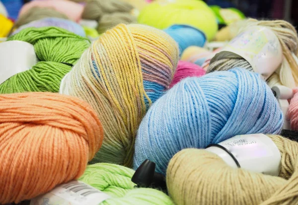The colored yarn. Colored balls of yarn. Yarn for knitting.