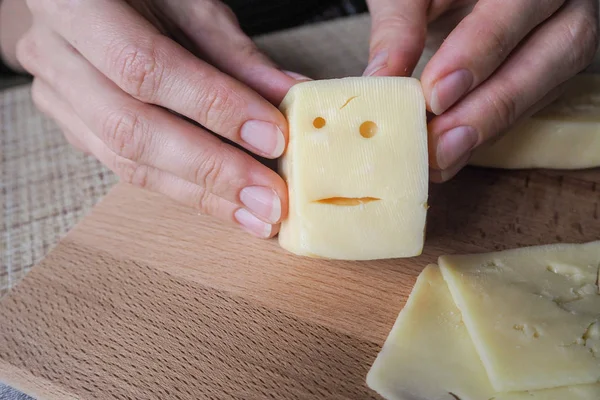 Funny cheese. A piece of cheese with the face. — Stock Photo, Image
