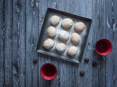 Handmade Ramadan sweets are served with tea on the table. Egyptian cookies 