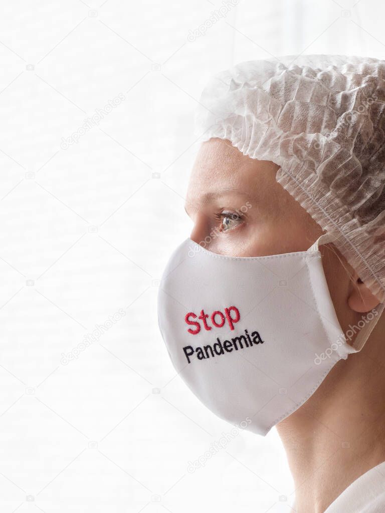 Doctor wearing protection face mask against coronavirus. Stop Pandemia