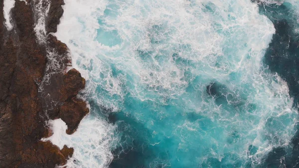 Top-down view of the ocean washing the large beautiful rocks on the Atlantic coast, Tenerife — Stock Photo, Image