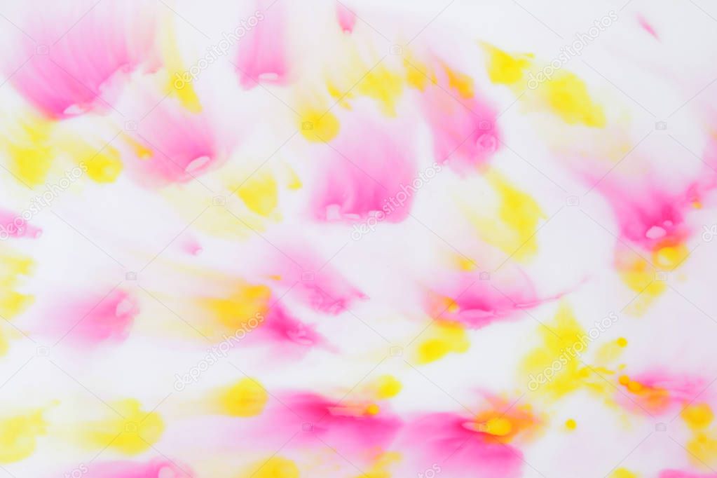 Pink and yellow abstract spots on white background, paint dissolved in milk, art, abstract pink yellow texture on white background for designer