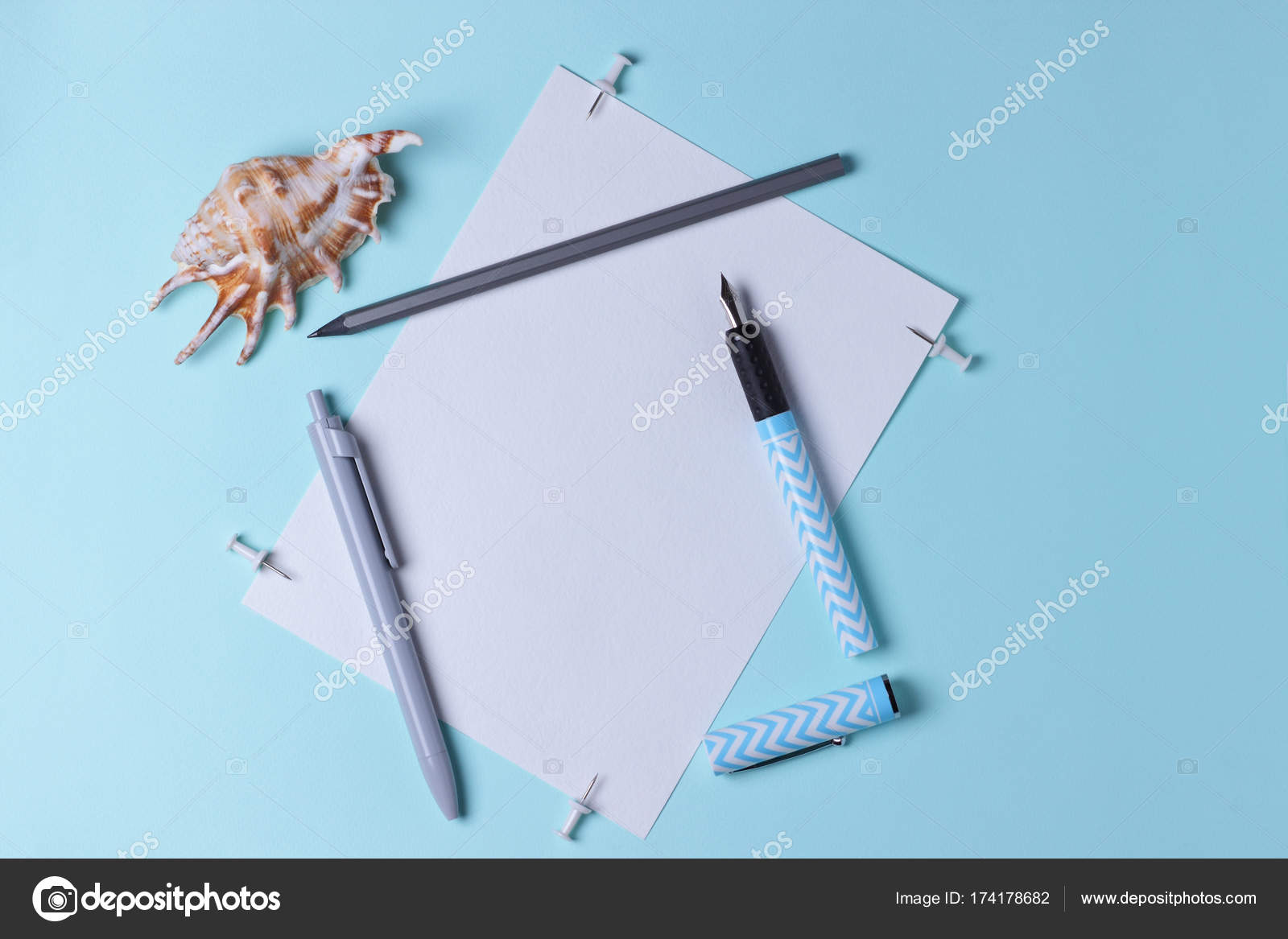 Stationery, pop art, surrealism, seashell on the office table, white blue fountain pen, gray