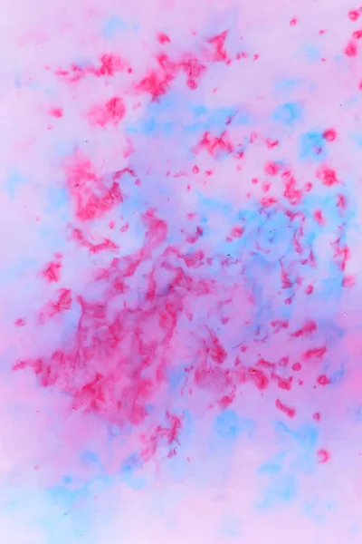 Abstract blue pink paint background on liquid, blue pink holographic stains on milk, multicolored cosmic pattern, minimalism, pop art texture for designer