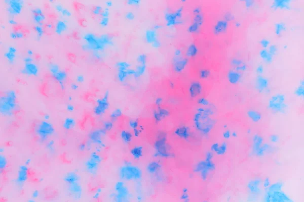 Abstract blue pink paint background on liquid, blue pink holographic stains on milk, holographic cosmic pattern, minimalism, pop art texture for designer