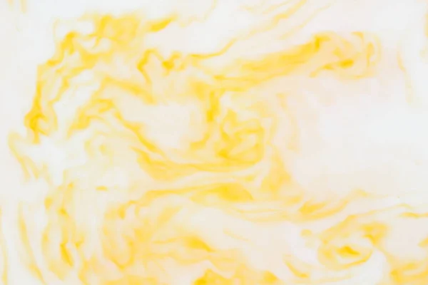 Yellow white abstract background, yellow pattern of paints on liquid, blank for designer, paint divorces in milk, bright texture on white background, minimalism, creative blank for wallpaper