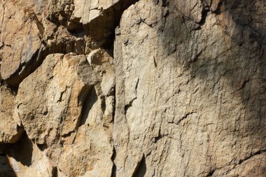 Doğal taş granit doku, granit desen. Taş benekli granit volkanik kaya Mutfak Tezgah vb için kullanılan arka plan. Kahverengi renk tonu ile mermer yüzey