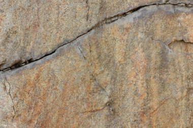Doğal taş granit doku, granit desen. Taş benekli granit volkanik kaya Mutfak Tezgah vb için kullanılan arka plan. Kahverengi renk tonu ile mermer yüzey