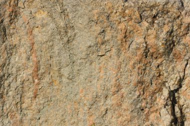 Doğal taş granit doku, granit desen. Taş benekli granit volkanik kaya Mutfak Tezgah vb için kullanılan arka plan. Kahverengi renk tonu ile mermer yüzey