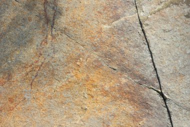 Doğal taş granit doku, granit desen. Taş benekli granit volkanik kaya Mutfak Tezgah vb için kullanılan arka plan. Kahverengi renk tonu ile mermer yüzey. Minimalizm