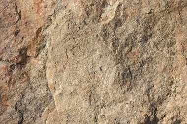 Doğal taş granit doku, granit desen. Taş benekli granit volkanik kaya Mutfak Tezgah vb için kullanılan arka plan. Kahverengi renk tonu ile mermer yüzey. Minimalizm