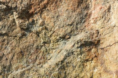 Doğal taş granit doku, granit desen. Taş benekli granit volkanik kaya Mutfak Tezgah vb için kullanılan arka plan. Kahverengi renk tonu ile mermer yüzey. Minimalizm