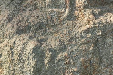 Doğal taş granit doku, granit desen. Taş benekli granit volkanik kaya Mutfak Tezgah vb için kullanılan arka plan. Kahverengi renk tonu ile mermer yüzey. Minimalizm