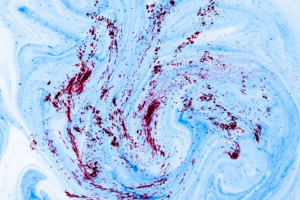 Fluid Art with pink blue color. Abstract multicolored background. Blue pink texture. Colored paint stains in liquid. Marble art. Fantastic iridescent colors