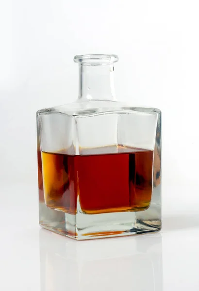 Carafe with whiskey on white background — Stock Photo, Image