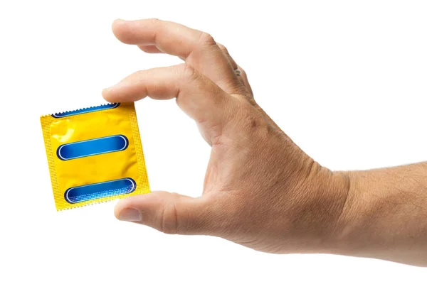 Kondom v ženské ruce, samostatný — Stock fotografie