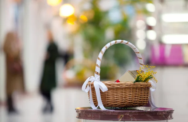 basket with a gift and flowers shop.